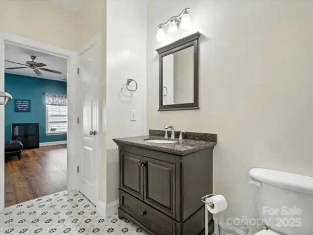 a view of a house with backyard sitting area and garden