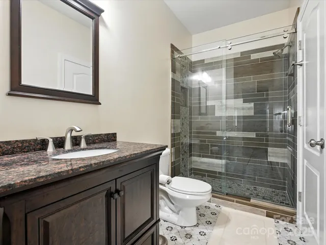 an aerial view of a house with outdoor space