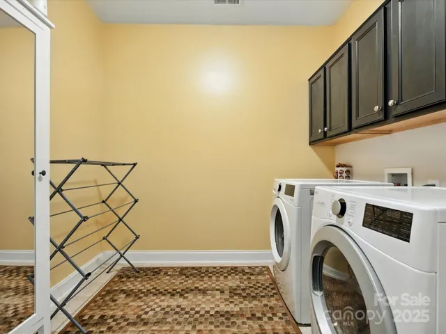 a view of a house with pool and chairs