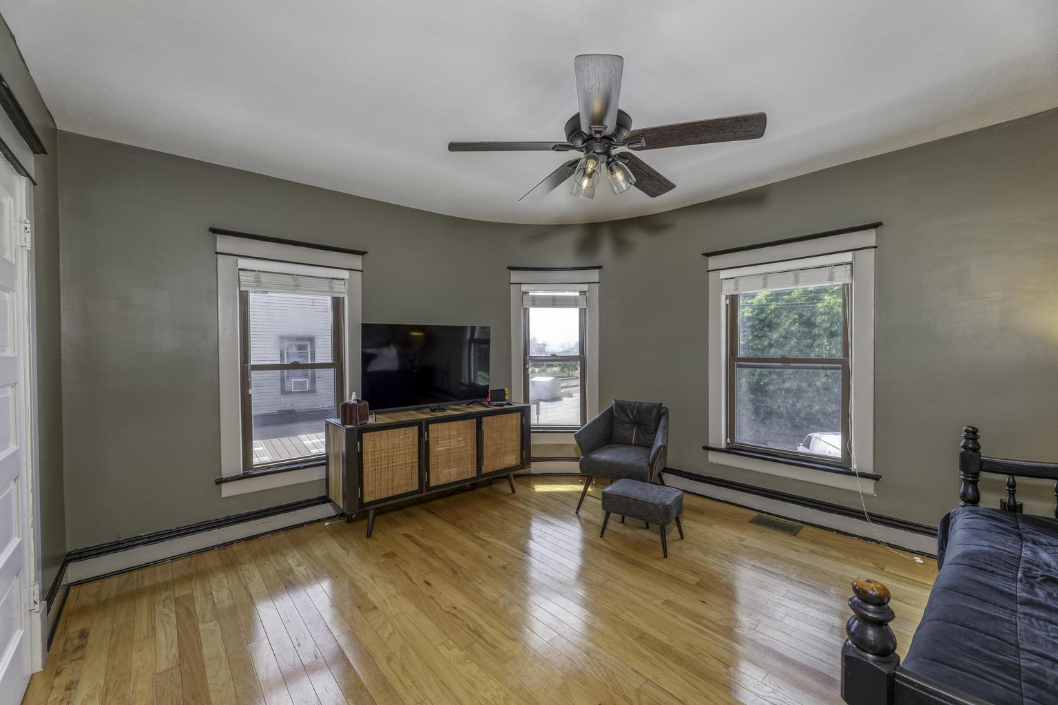 507 Center Street Michigan City, IN 46360 - Photo 23 of 42 a living room with furniture and a flat screen tv
