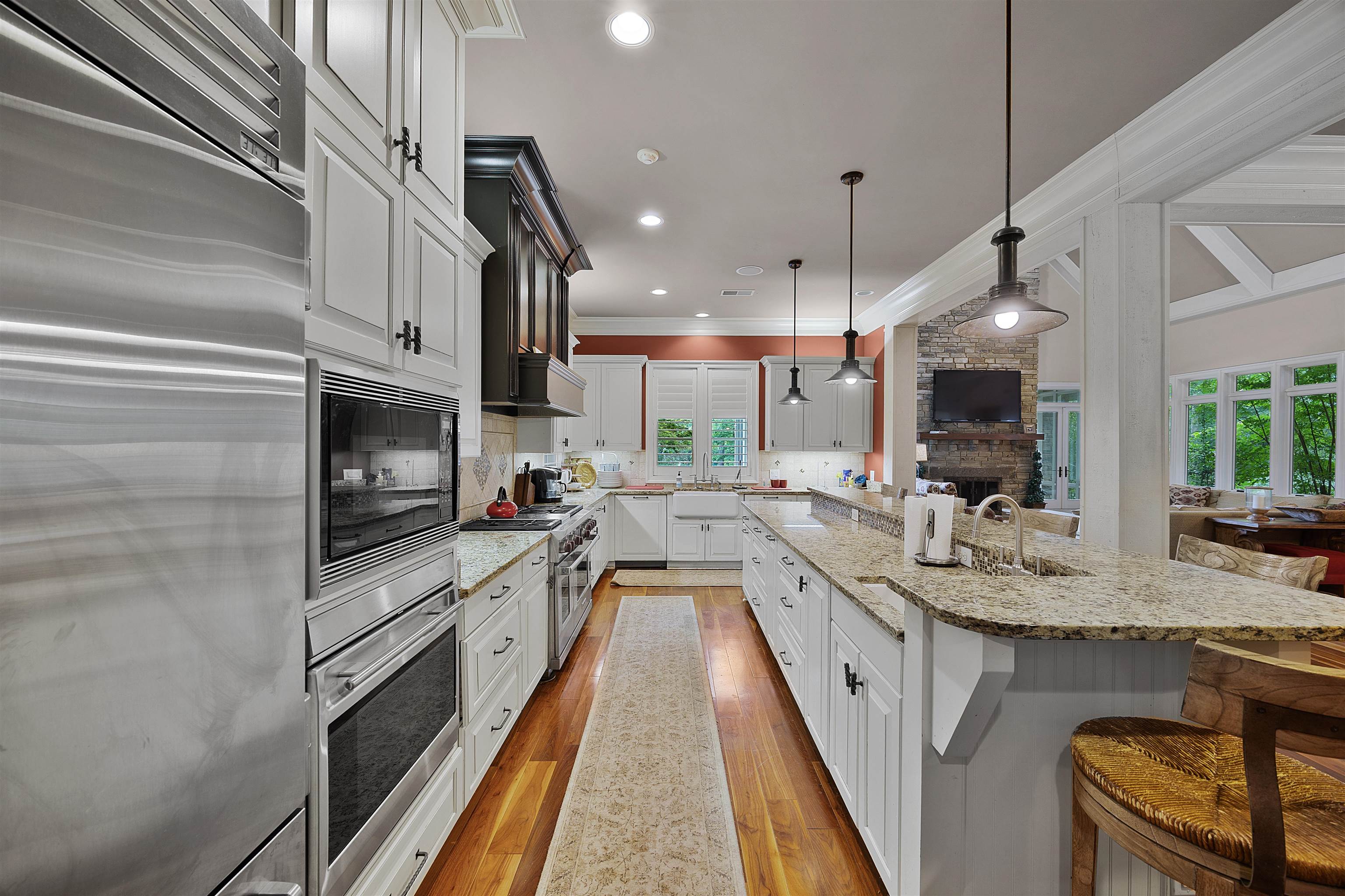 25 Caney Hollow Road Counce, TN 38326 - Photo 11 of 40 a large kitchen with kitchen island a large counter space a sink appliances and cabinets