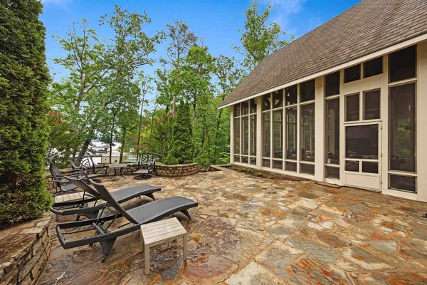 a view of a backyard with sitting area
