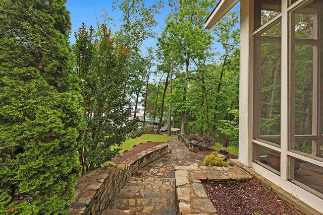 a living room with furniture ceiling fan and a rug