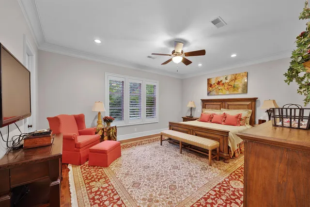 a en suite bathroom with a tub double vanity and windows