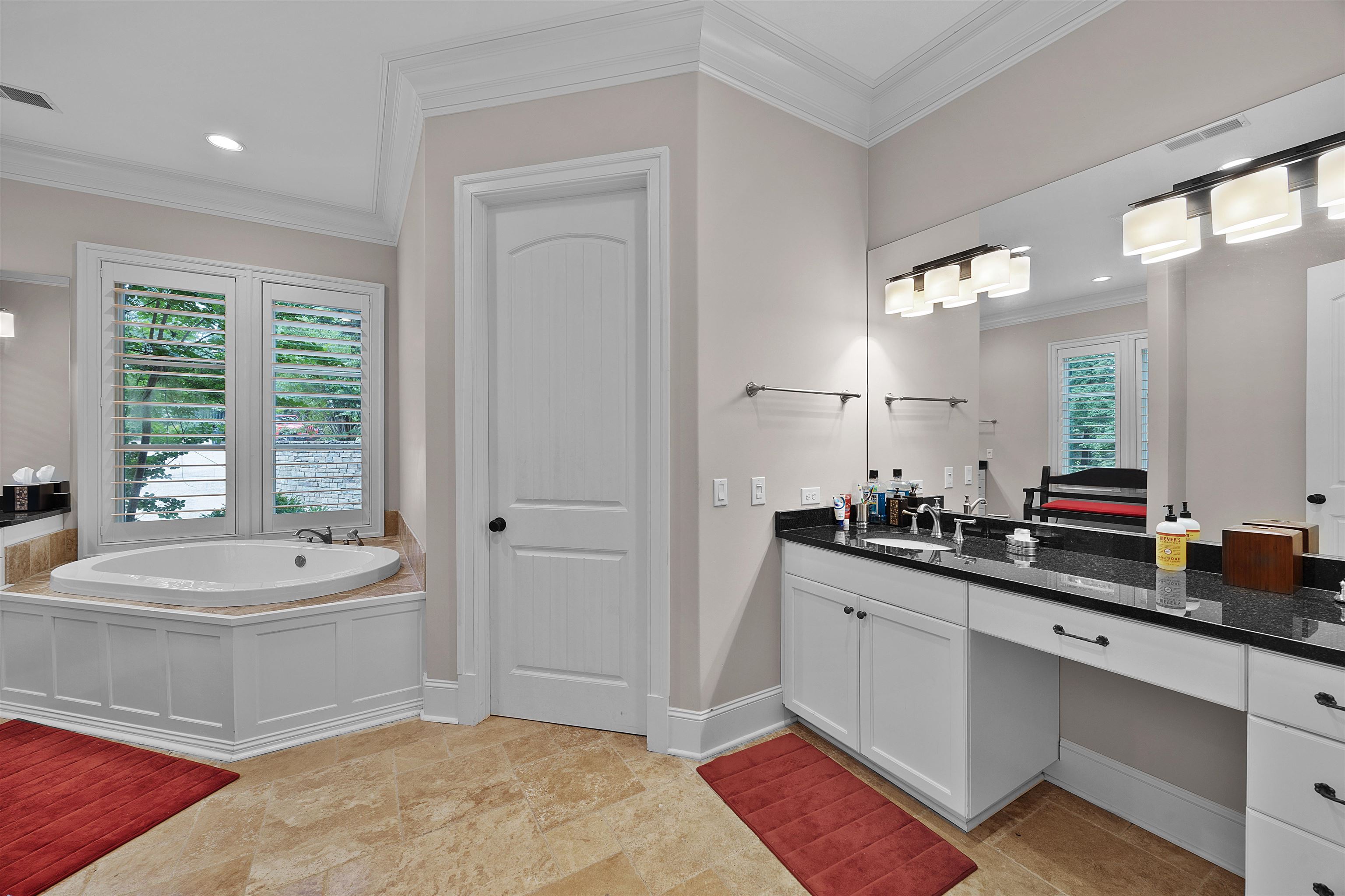 25 Caney Hollow Road Counce, TN 38326 - Photo 18 of 40 a bathroom with a double vanity sink a mirror and a bathtub