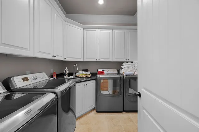 a bathroom with a double vanity sink and mirror