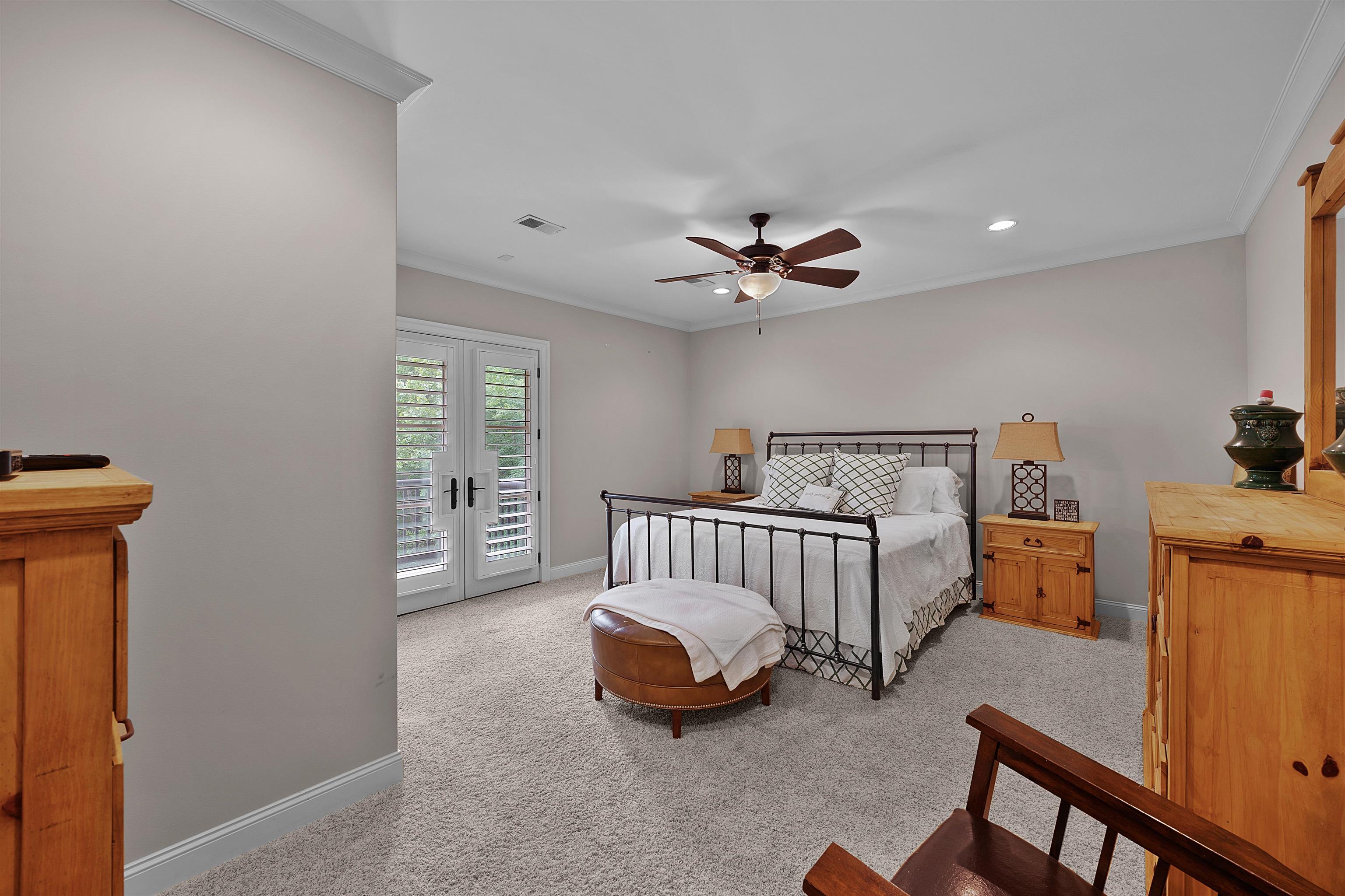25 Caney Hollow Road Counce, TN 38326 - Photo 24 of 40 a bedroom with a bed and a chandelier