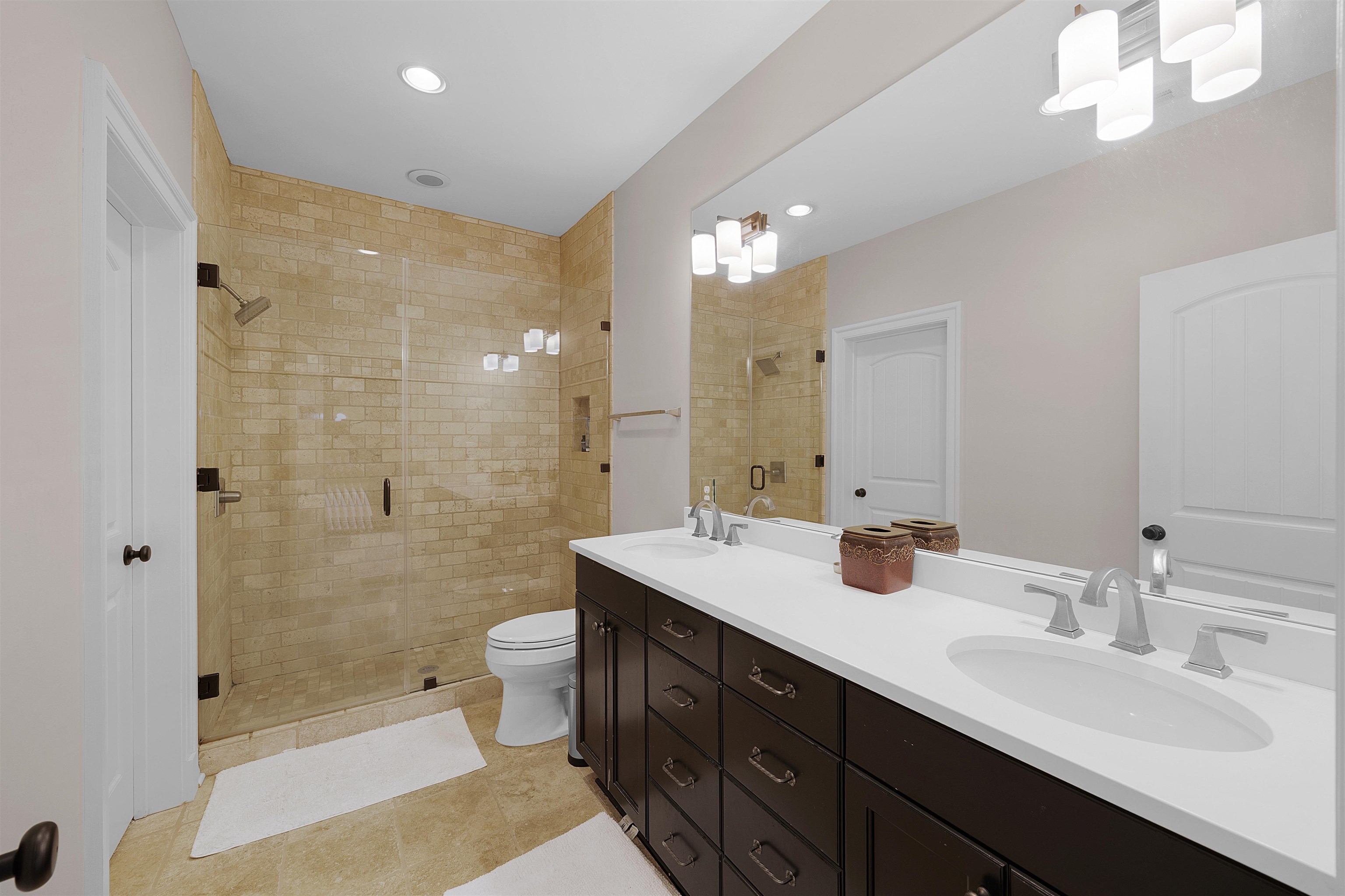 25 Caney Hollow Road Counce, TN 38326 - Photo 25 of 40 a bathroom with double sink shower and a mirror