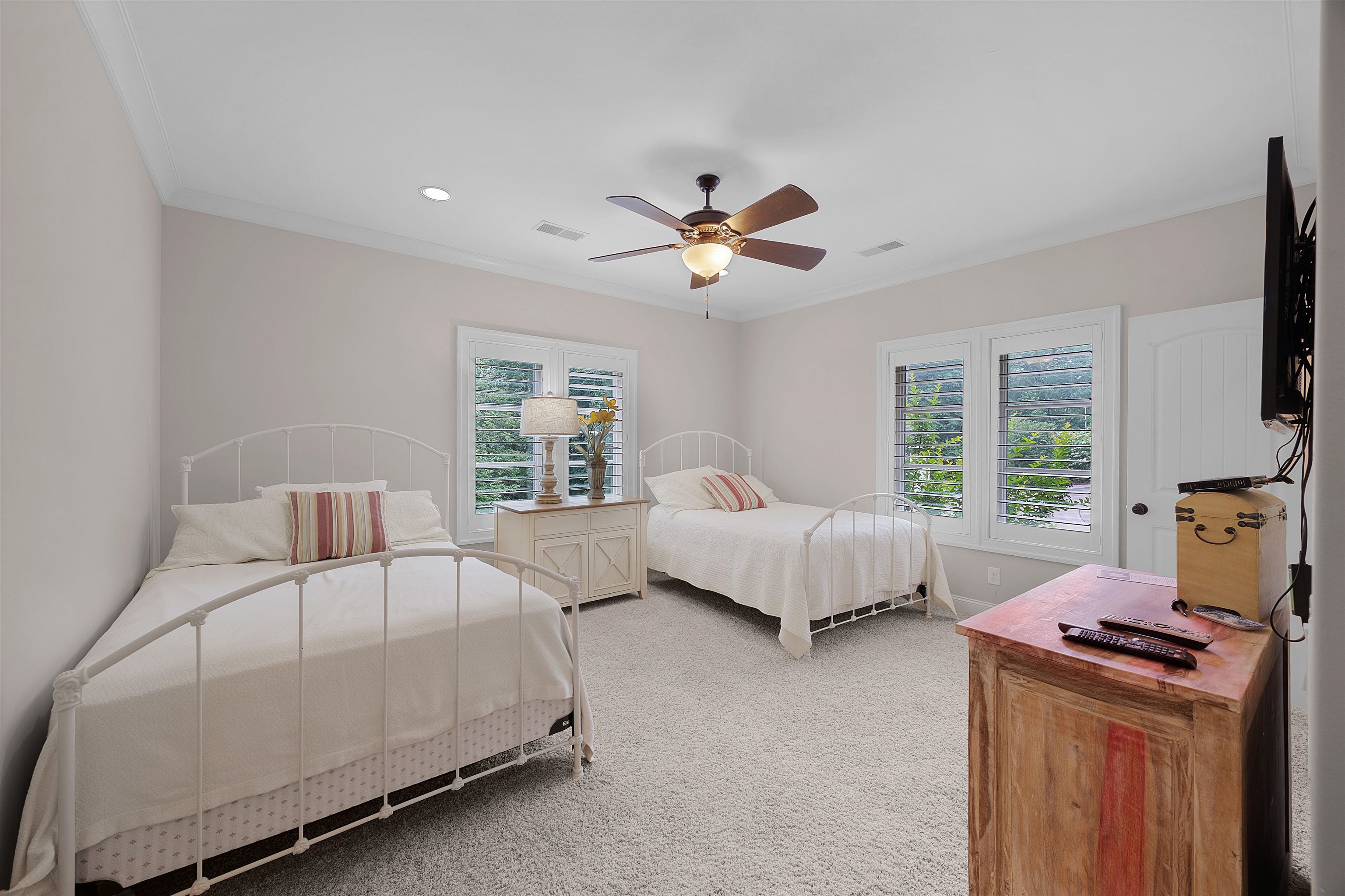 25 Caney Hollow Road Counce, TN 38326 - Photo 31 of 40 a bedroom with a bed and a chandelier