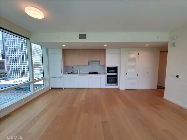 a view of a kitchen with a sink and a window