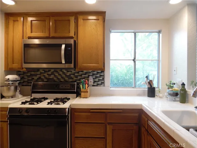 a view of a livingroom with furniture and a window