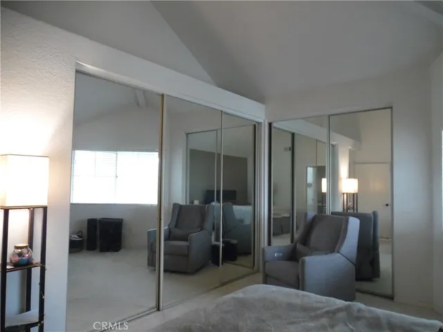 a en suite bathroom with a toilet sink and glass door