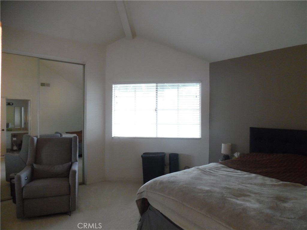 1806 Rory Lane, Unit 9 Simi Valley, CA 93063 - Photo 21 of 28 a bedroom with a bed and a window