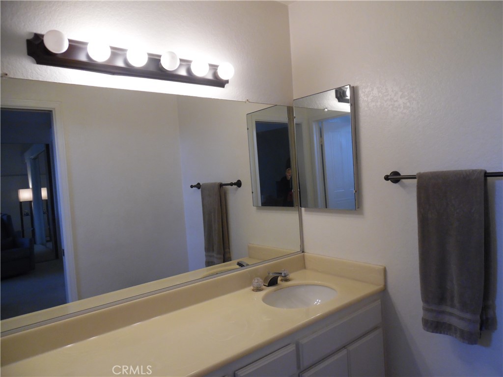 1806 Rory Lane, Unit 9 Simi Valley, CA 93063 - Photo 23 of 28 a bathroom with a sink and a mirror