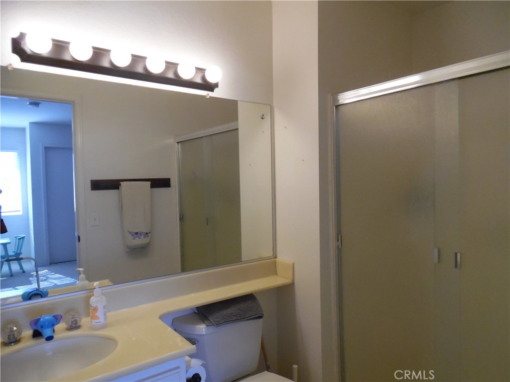 1806 Rory Lane, Unit 9 Simi Valley, CA 93063 - Photo 26 of 28 a bathroom with a sink and a mirror