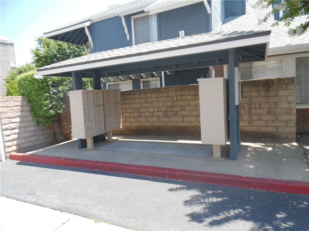 1806 Rory Lane, Unit 9 Simi Valley, CA 93063 - Photo 27 of 28 a front view of a house with a garage