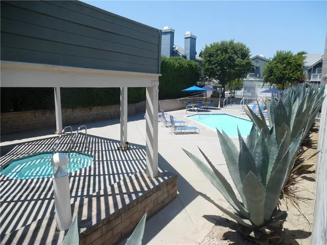 a view of a backyard with sitting area and furniture