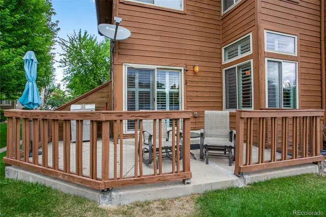 a view of a house with wooden fence