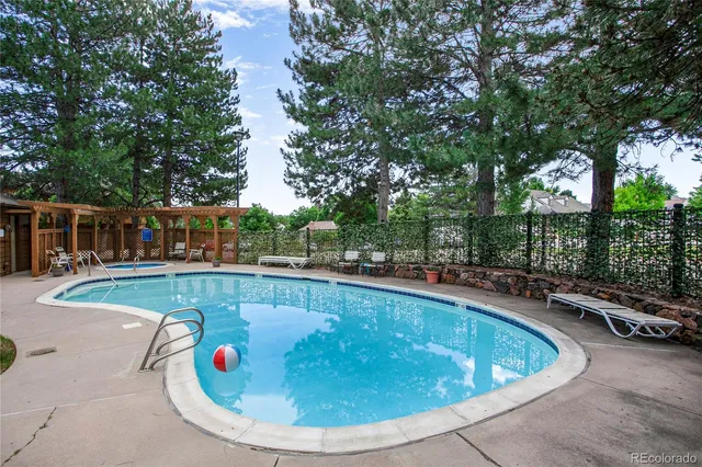 a view of a swimming pool with a patio