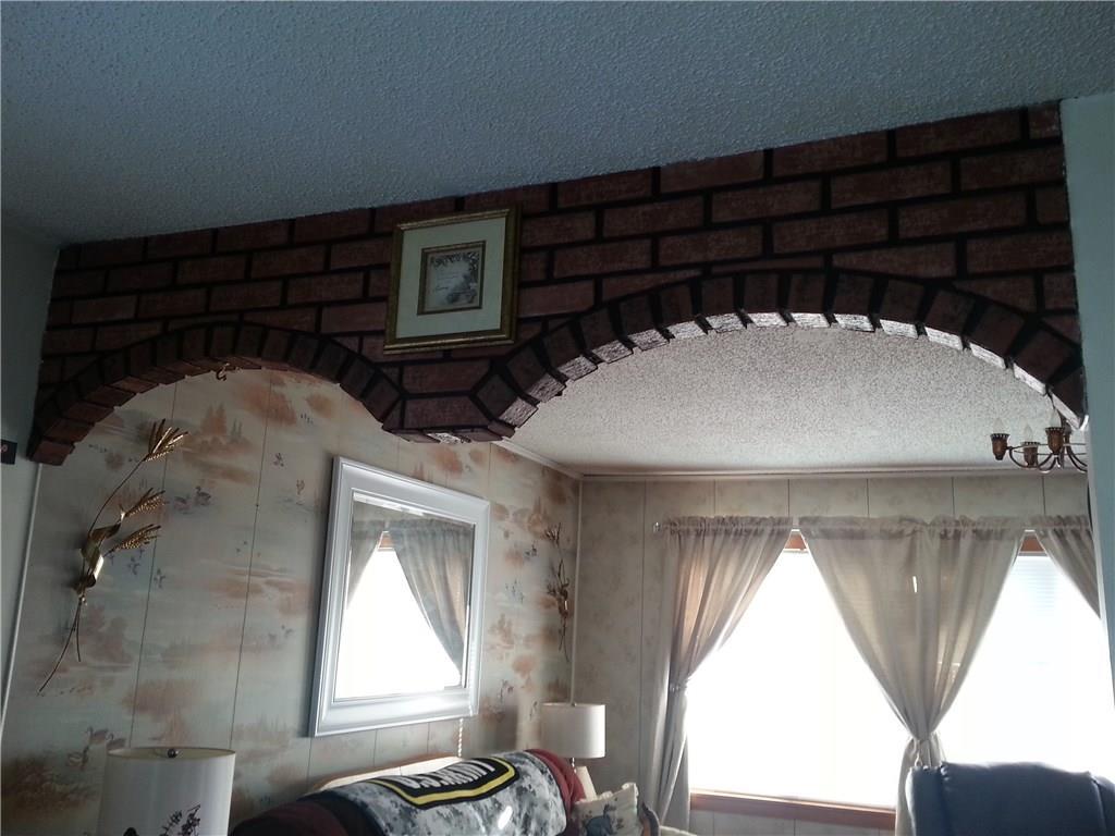 107 Dinsmore Road Sidney, ME 04330 - Photo 5 of 25 DOUBLE ARCHWAY BETWEEN DINING AREA...