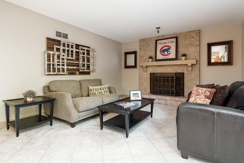 1753 Madron Road Rockford, IL 61107 - Photo 10 of 46 a living room with furniture and a fireplace