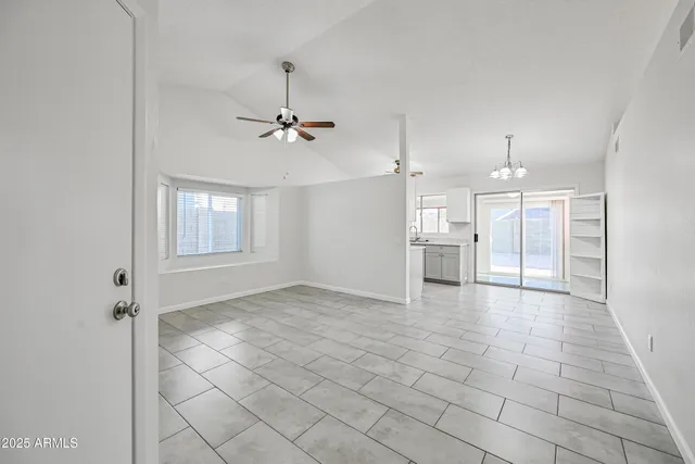 a view of a kitchen with a sink and a refrigerator