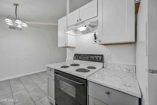 a kitchen with a stove and a table