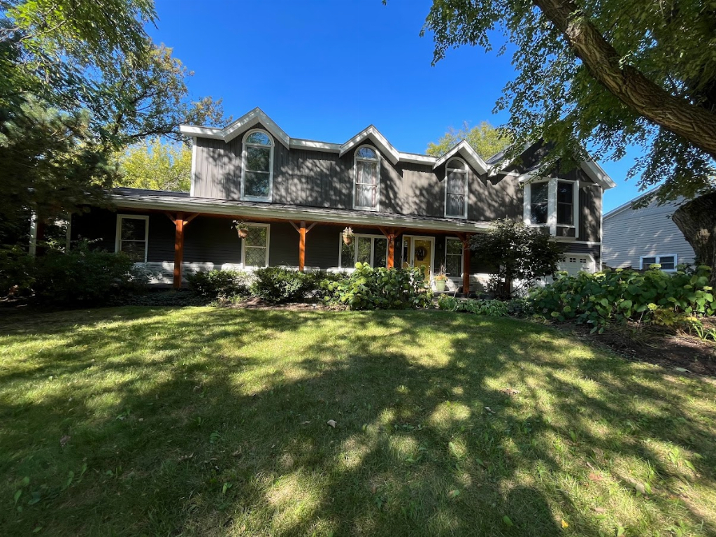 923 Parkside Road Naperville, IL 60540 - Photo 1 of 25 a front view of a house with garden