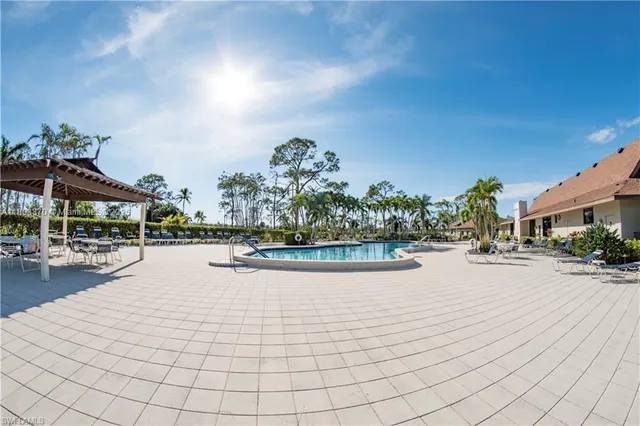 a view of a swimming pool outdoor seating