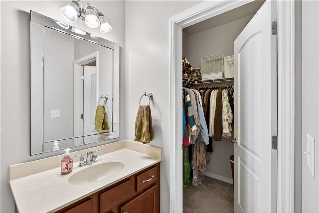 340 Scott Farm Drive Powder Springs, GA 30127 - Photo 33 of 59 a bathroom with a sink vanity and a mirror