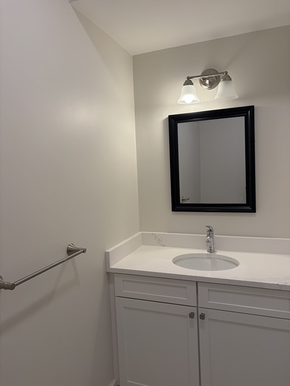 76 Valmor Street Worcester, MA 01604 - Photo 10 of 20 a bathroom with a sink and a mirror