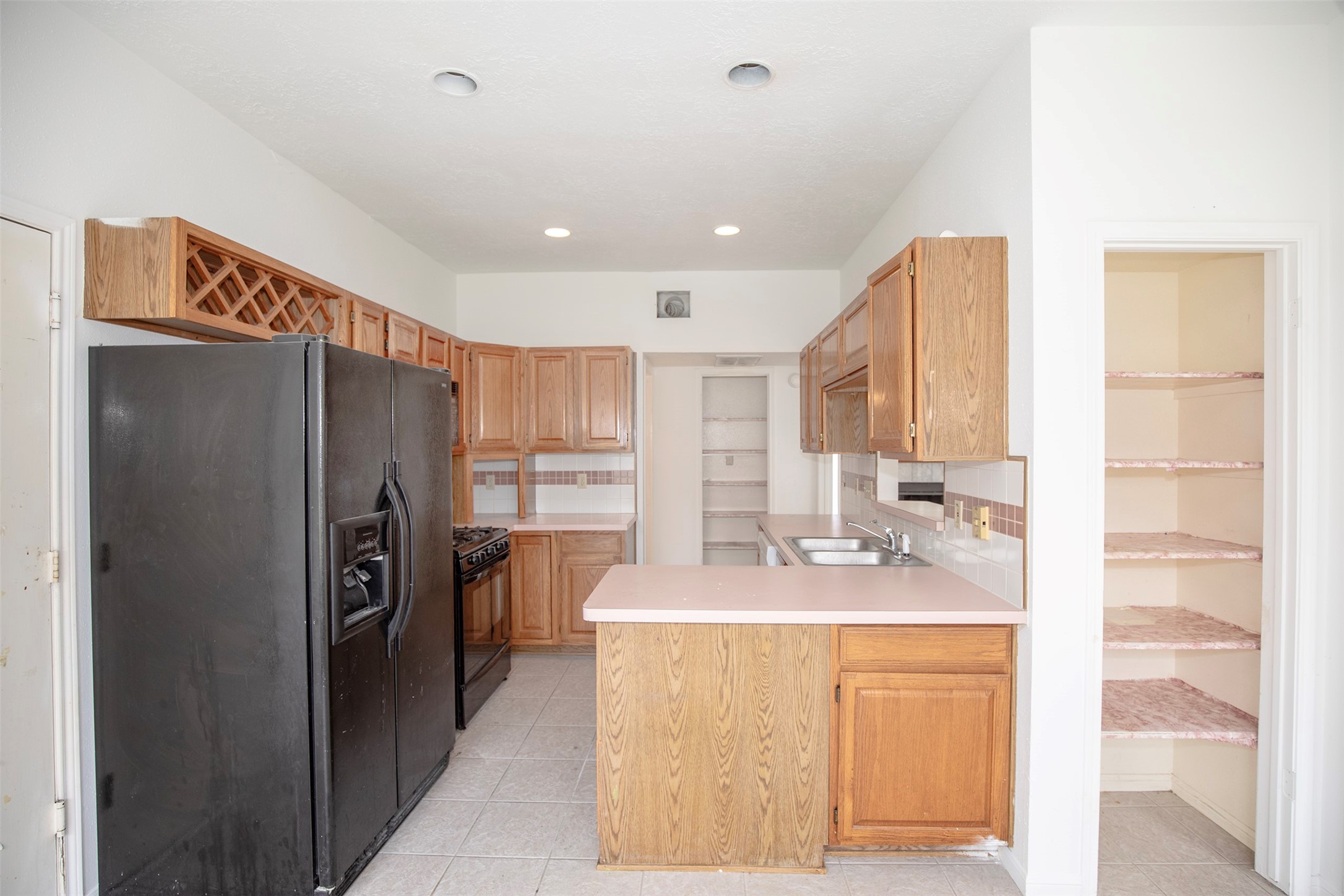 1627 Mabry Mill Road Houston, TX 77062 - Photo 14 of 32 a kitchen with stainless steel appliances granite countertop a refrigerator and a sink