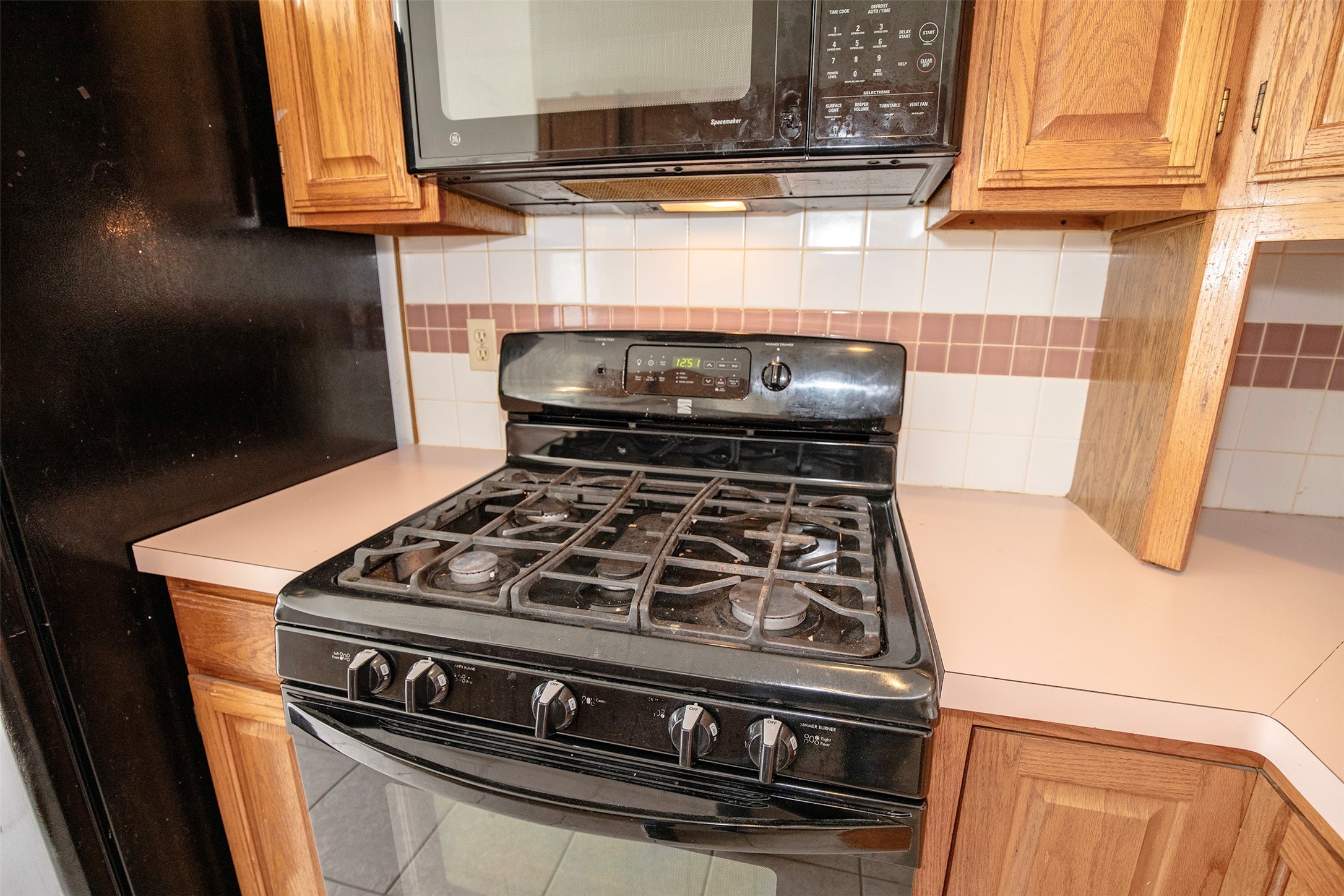 1627 Mabry Mill Road Houston, TX 77062 - Photo 15 of 32 a stove top oven sitting inside of a kitchen