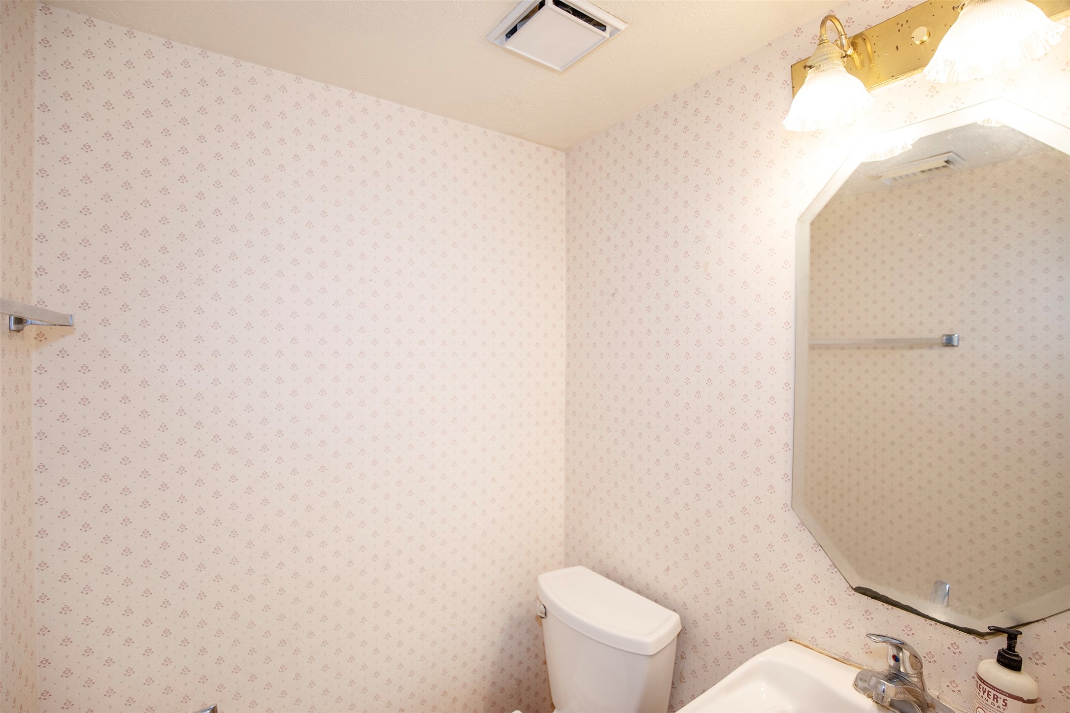 1627 Mabry Mill Road Houston, TX 77062 - Photo 17 of 32 a white toilet sitting next to a white wall