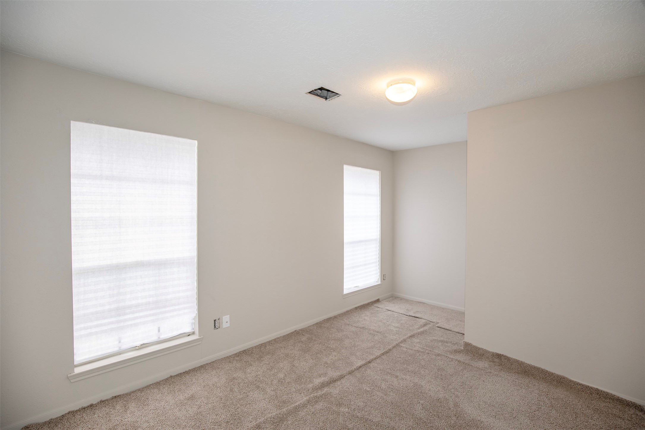 1627 Mabry Mill Road Houston, TX 77062 - Photo 18 of 32 an empty room with windows