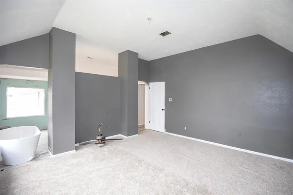 a view of a room with a potted plant