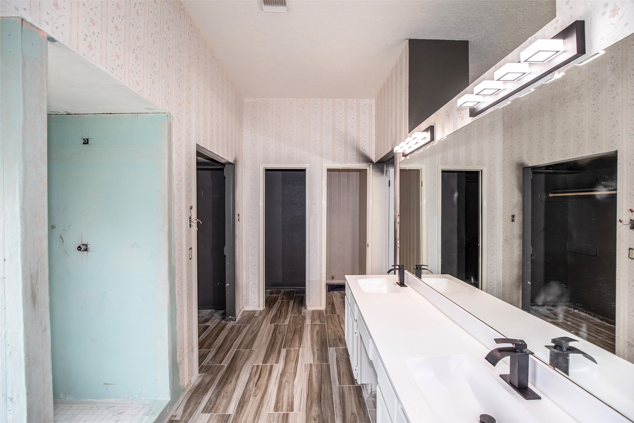 1627 Mabry Mill Road Houston, TX 77062 - Photo 22 of 32 a spacious bathroom with a double vanity sink and mirror