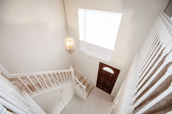 a view of a room with a fireplace and wooden floor