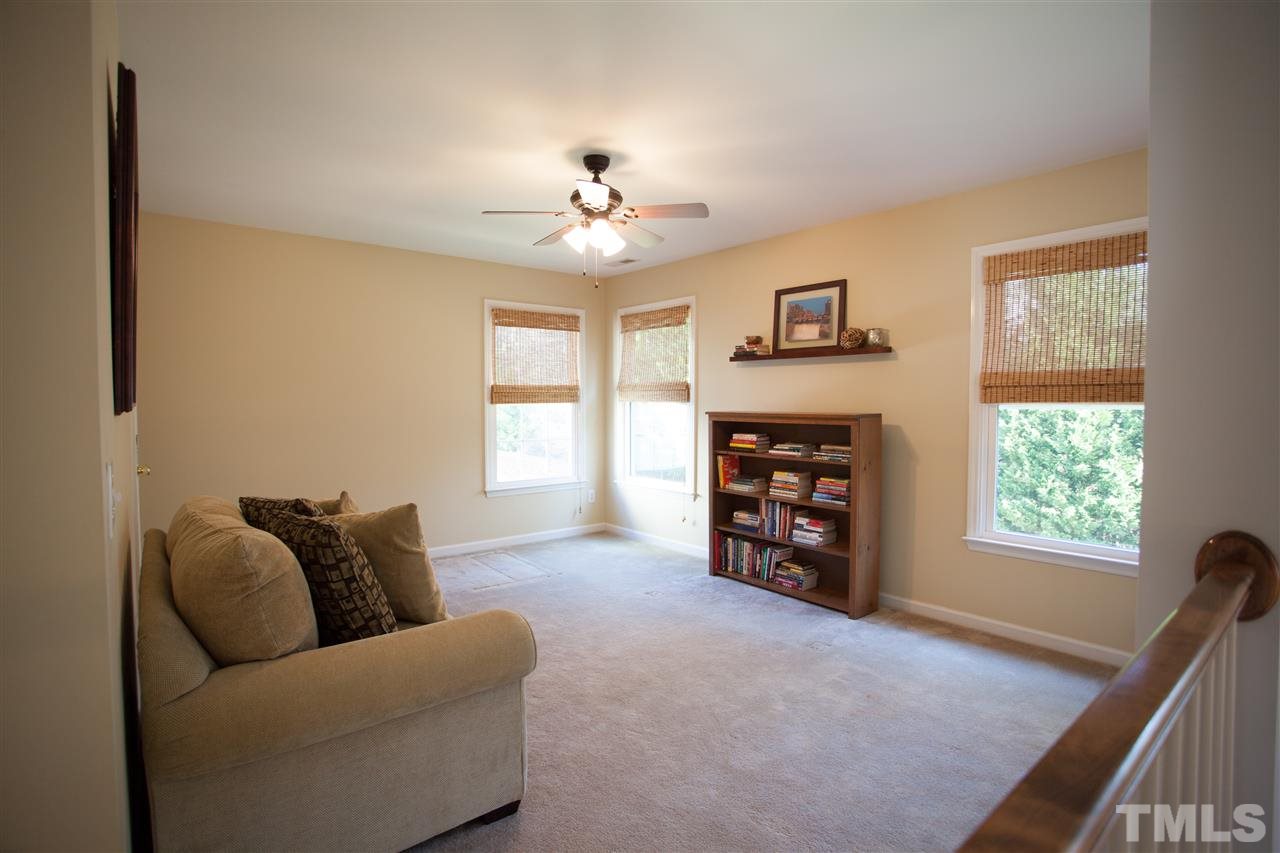 8820 Braceridge Road Raleigh, NC 27613 - Photo 19 of 22 a living room with furniture and a window