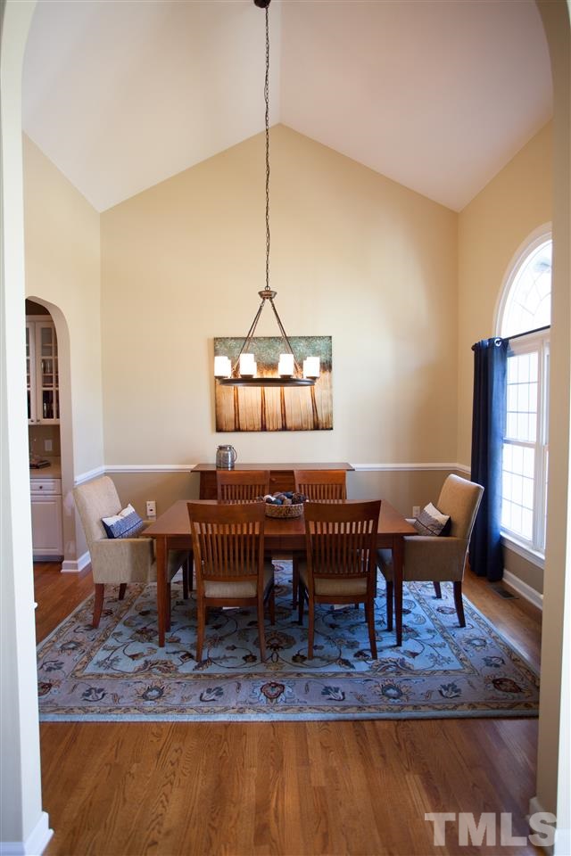 8820 Braceridge Road Raleigh, NC 27613 - Photo 3 of 22 a living room with furniture a window and a table