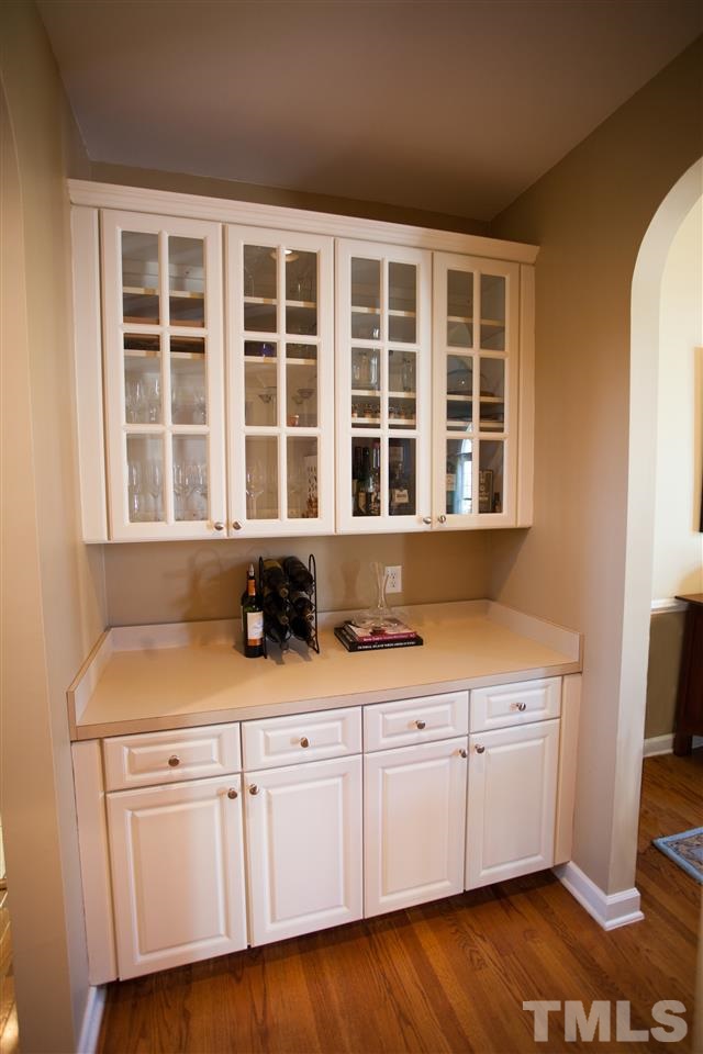 8820 Braceridge Road Raleigh, NC 27613 - Photo 7 of 22 a kitchen with a sink and cabinets