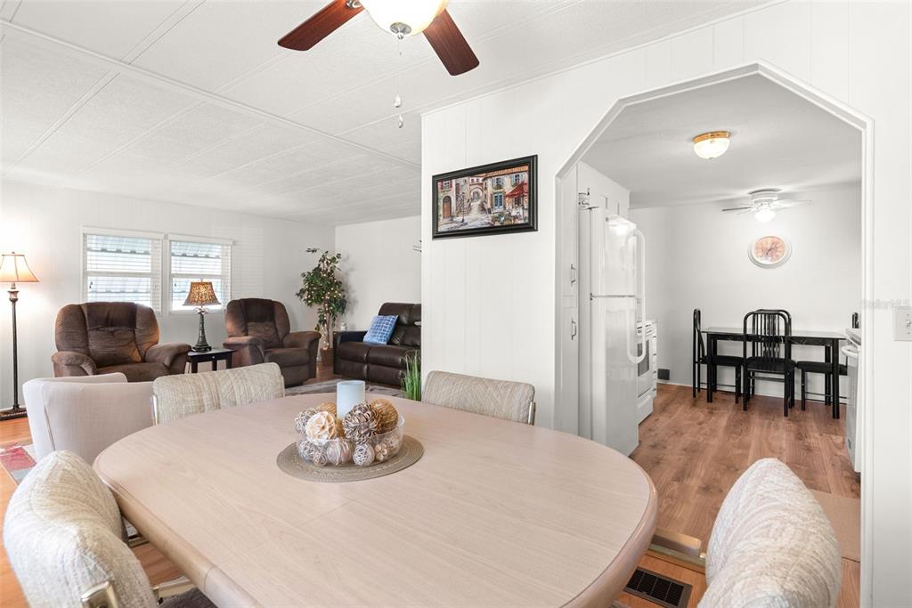 1610 Reynolds Road, Unit 98 Lakeland, FL 33801 - Photo 15 of 36 a view of a dining room with furniture and wooden floor