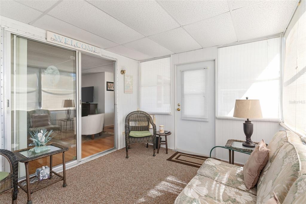 1610 Reynolds Road, Unit 98 Lakeland, FL 33801 - Photo 17 of 36 a bedroom with furniture and a lamp