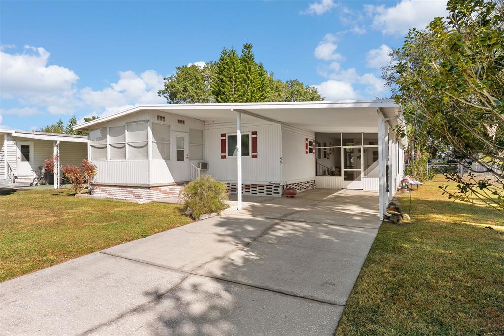 1610 Reynolds Road, Unit 98 Lakeland, FL 33801 - Photo 2 of 36 a view of a house with a yard