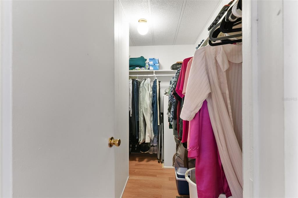 1610 Reynolds Road, Unit 98 Lakeland, FL 33801 - Photo 22 of 36 a view of walk in closet with clothes
