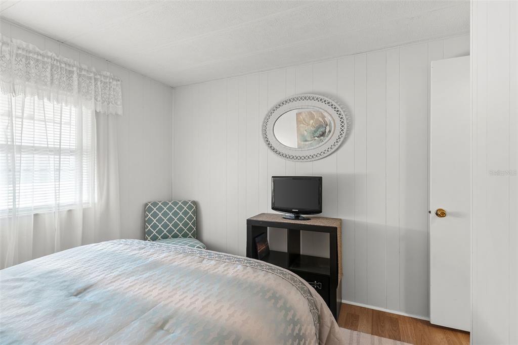 1610 Reynolds Road, Unit 98 Lakeland, FL 33801 - Photo 25 of 36 a bedroom with a bed and a window