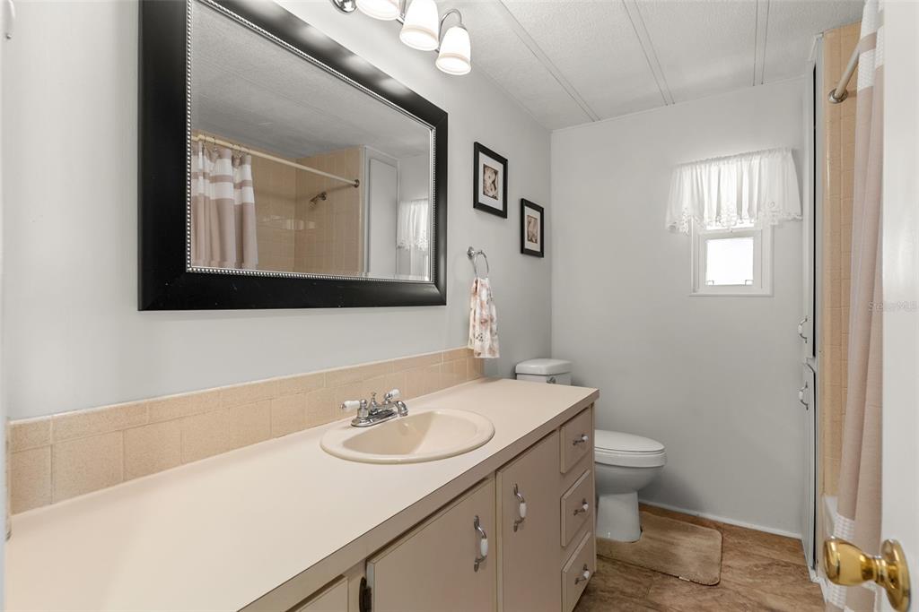 1610 Reynolds Road, Unit 98 Lakeland, FL 33801 - Photo 26 of 36 a bathroom with a sink and a mirror
