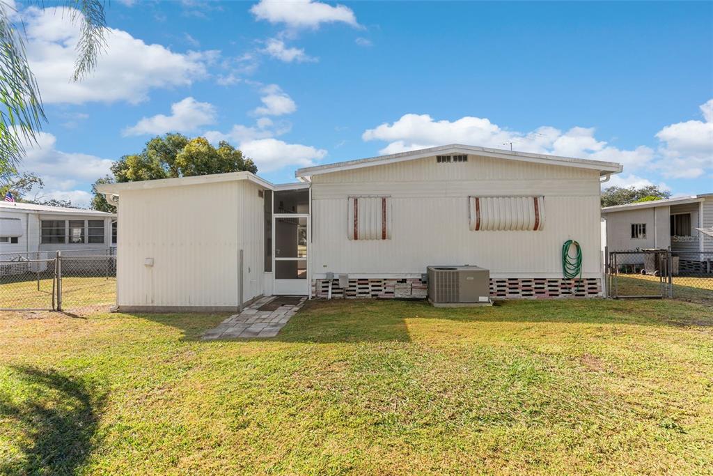 1610 Reynolds Road, Unit 98 Lakeland, FL 33801 - Photo 28 of 36 a view of a swimming pool with a chair and tables