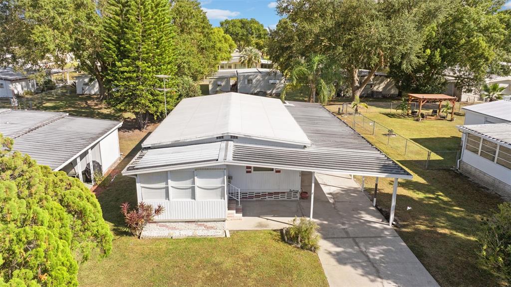 1610 Reynolds Road, Unit 98 Lakeland, FL 33801 - Photo 31 of 36 a view of a patio with chairs and a table