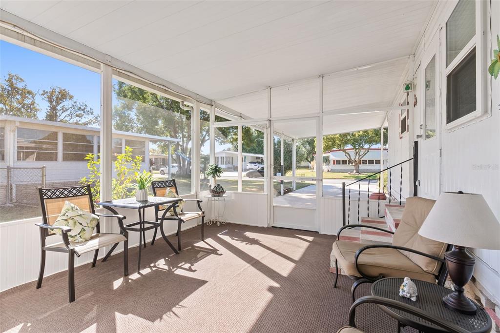 1610 Reynolds Road, Unit 98 Lakeland, FL 33801 - Photo 5 of 36 a room with lots of tables a large window and chairs
